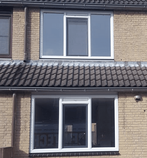 Gevel woning met kunststof kozijnen boven en beneden